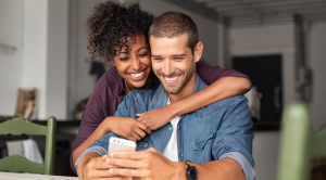 Couple looking at smartphone
